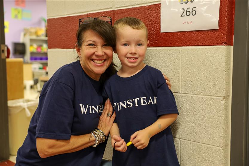 A woman and boy smile